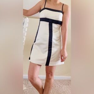 Adorable mini dress by BCBGMaxazria size 4 with spaghetti straps and front bow